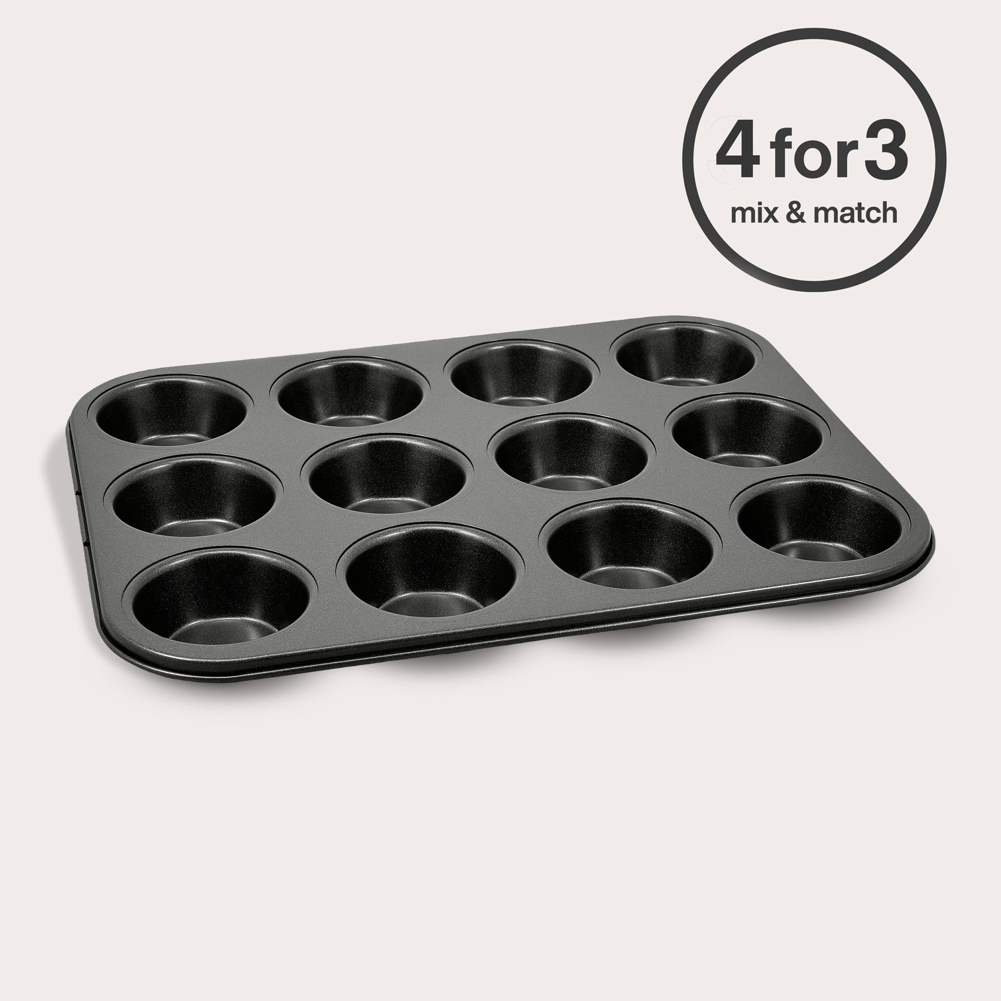 The Zyliss Non-Stick 12 Hole Muffin Pan, crafted from carbon steel, rests on a light background with a "4 for 3 mix & match" circular offer label shown in the top right corner.