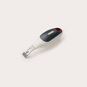 The Zyliss 2 In 1 Zester features a stainless steel peeler and zester with a black and white ergonomic handle plus a red accent, displayed on a plain white background—ideal for effortless citrus prep.