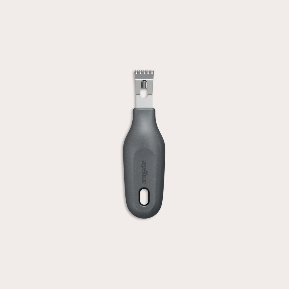 The Zyliss 2-In-1 Zester, made of stainless steel with a black ergonomic handle and a hole at the base, is an eco-friendly kitchen tool shown against a plain light background.
