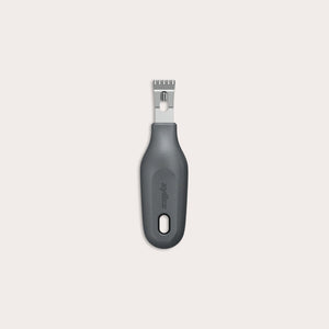 The Zyliss 2-In-1 Zester, made of stainless steel with a black ergonomic handle and a hole at the base, is an eco-friendly kitchen tool shown against a plain light background.