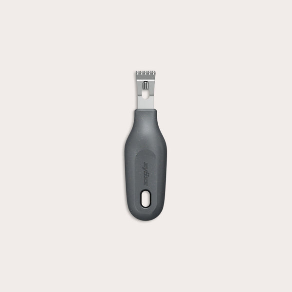 The Zyliss 2-In-1 Zester, made of stainless steel with a black ergonomic handle and a hole at the base, is an eco-friendly kitchen tool shown against a plain light background.