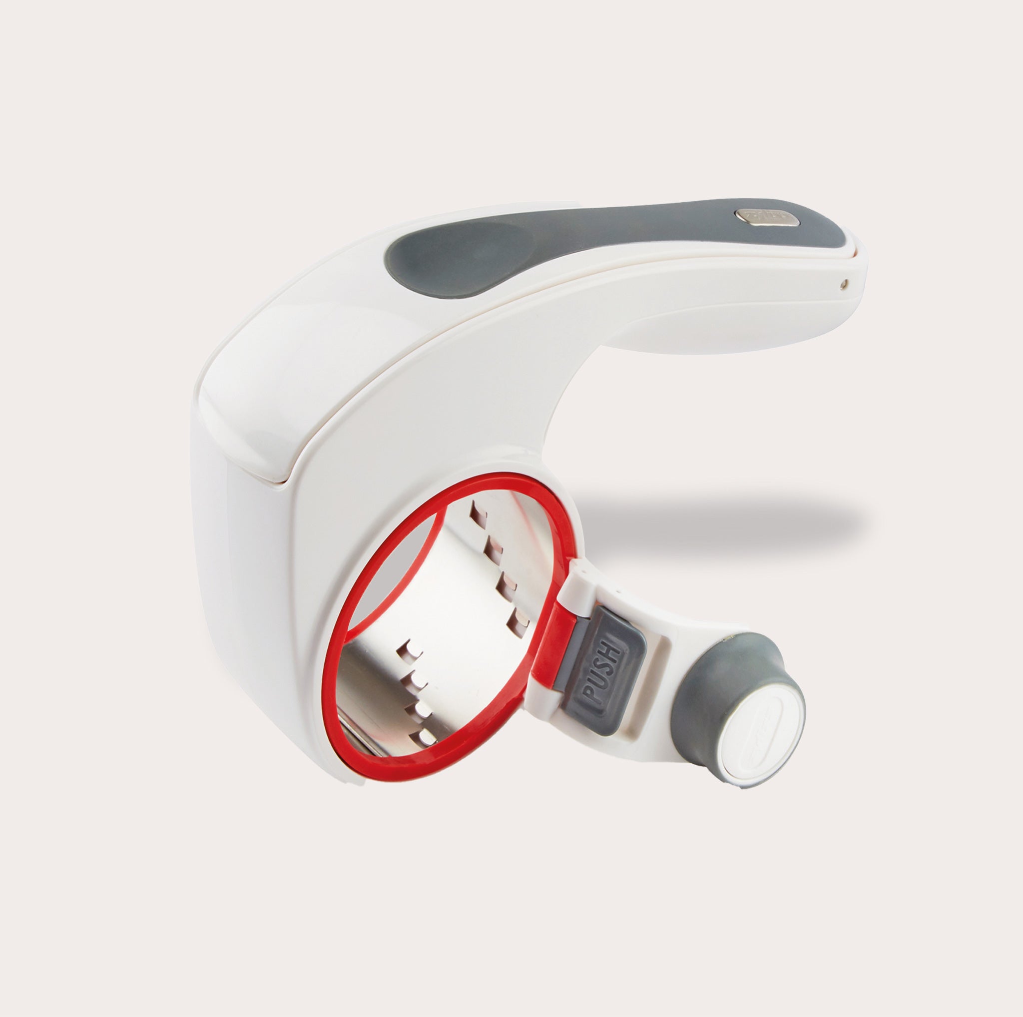 The Zyliss All Cheese Grater features stainless steel blades, interchangeable drums, a white handheld design, black grip, red drum rim, and gray push button for easy grating.