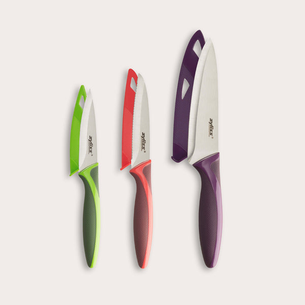 The Zyliss 3 Piece Knife Set includes three knives in green, red, and purple with matching blade covers—versatile essentials for any kitchen.