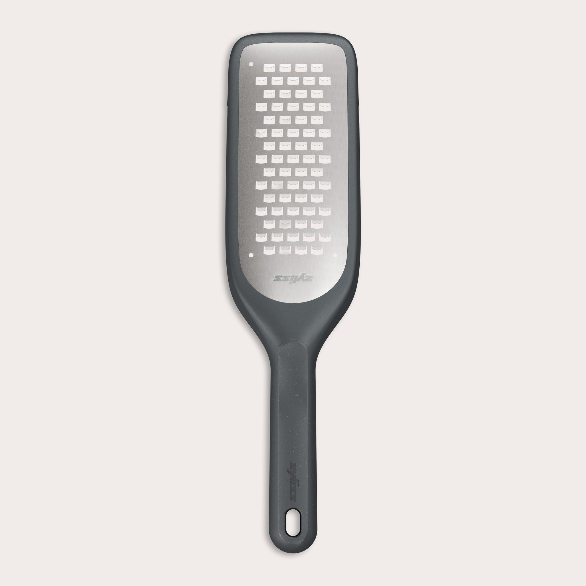 The Zyliss Coarse Grater is a black and silver foot file with a long handle and ultra-sharp grater surface, designed to efficiently remove dead skin from feet.