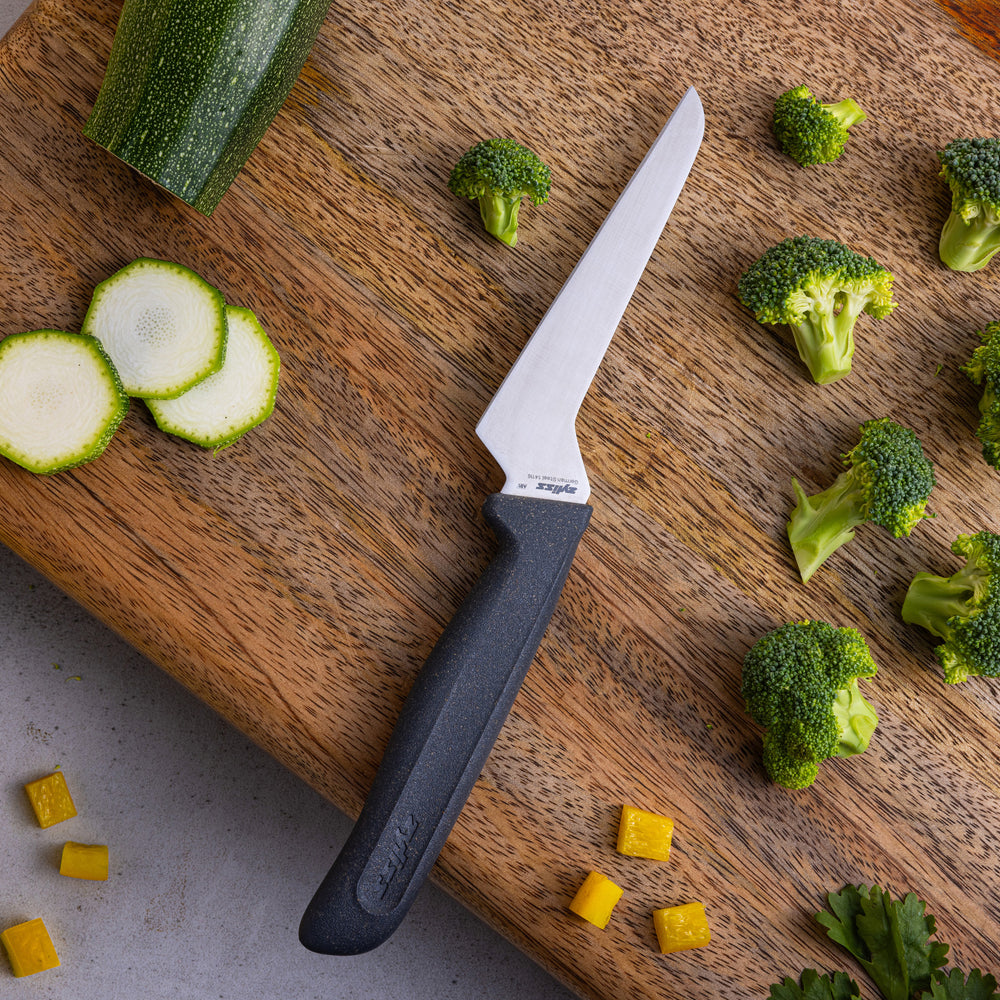 A Zyliss Offset Knife 10cm/4" with a straight silver blade and ergonomic handle is displayed. A “4 for 3 mix & match” label appears in the top right corner. The background is plain and light-colored.