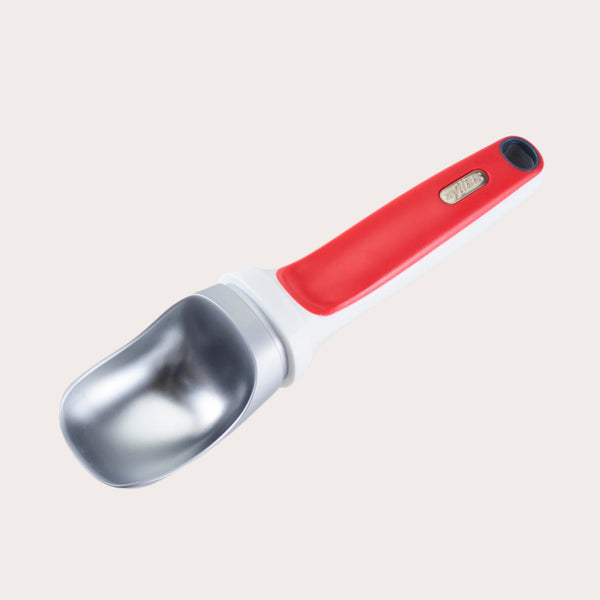 The Zyliss Right Scoop Ice Cream Scoop features a wide silver zinc alloy head and a red and white ergonomic handle with a small metallic label near the grip.