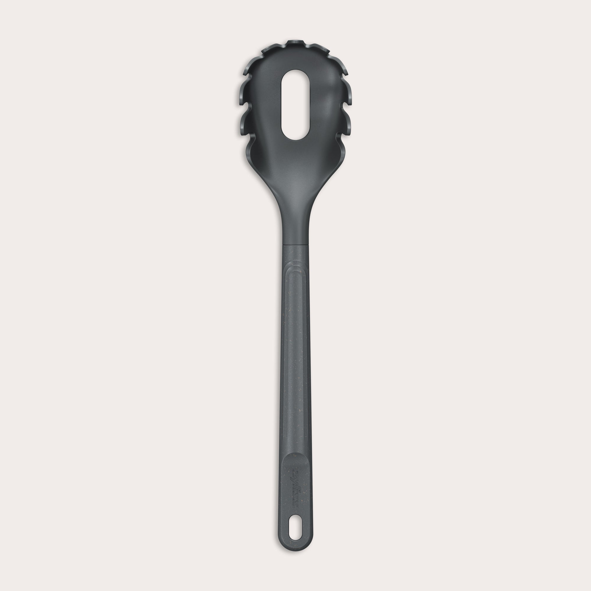 The Zyliss Spaghetti Server is a black, heat-resistant utensil with a long handle and slotted, rounded head featuring prongs for ideal portion control, shown isolated on a light background.