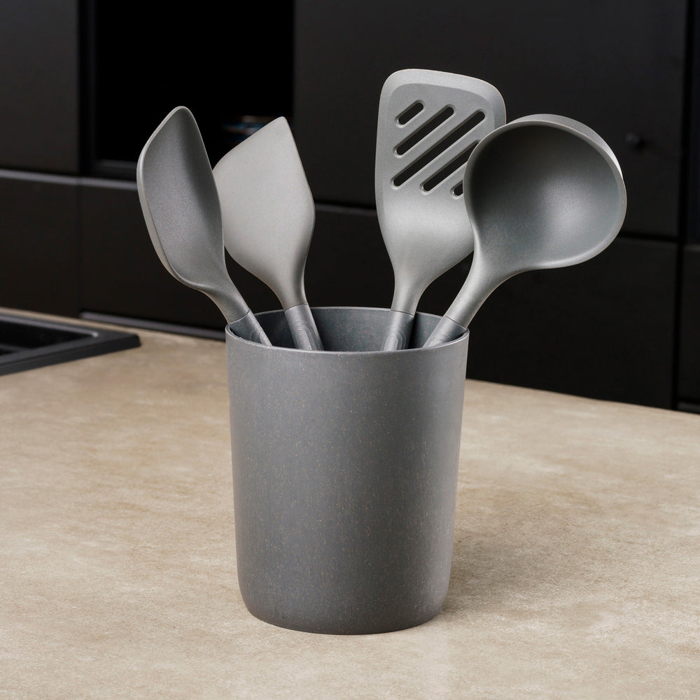 The Zyliss 5-Piece Utensil Set includes dark gray spatulas and serving spoons in a matching holder. All tools are dishwasher safe, making this set perfect for any modern kitchen.