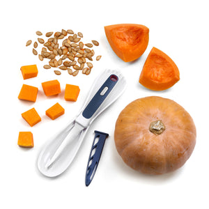 Whole pumpkin, cubes, seeds, and wedges are arranged with the Zyliss 3 In 1 Pumpkin & Squash Scoop & Knife—featuring a blue and white serrated blade and cover—the perfect kitchen tool for pumpkin prep.