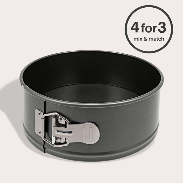 #23cm/9" The Zyliss Non-Stick Springform Cake Pan, crafted from durable carbon steel with a metal latch, is shown on a light background. A "4 for 3 mix & match" offer appears in a circle at the top right.