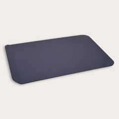 The Zyliss Durable Non-Stick Baking Sheet, a dark gray rectangular pan with rounded corners and heavy-gauge carbon steel construction, is displayed on a plain, light background.