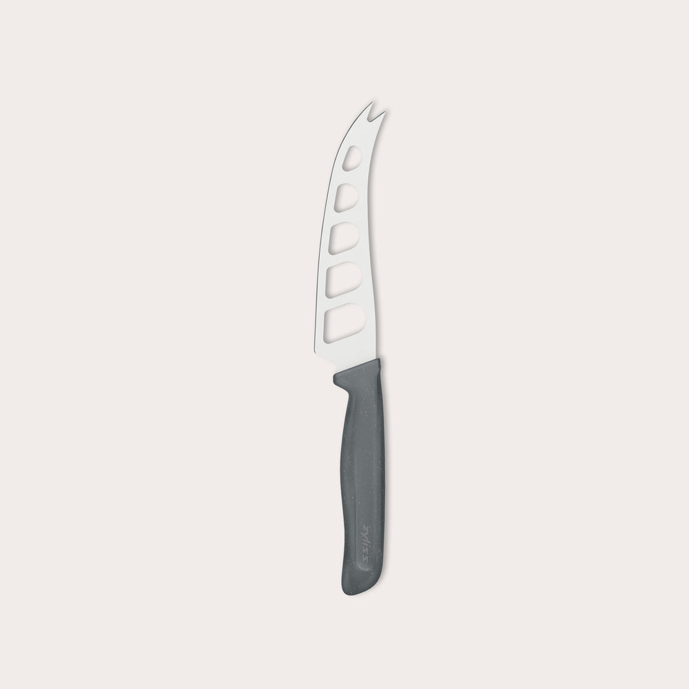 The Zyliss Cheese Knife 12.7cm/5" features a wheat straw handle and stainless steel blade with large holes and a forked tip, ideal for slicing and serving cheese, displayed against a plain white background.