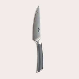 The Zyliss Comfort Pro Utility Knife 14cm/5½", crafted from German stainless steel with a gray ergonomic handle, is shown vertically against a plain light background.