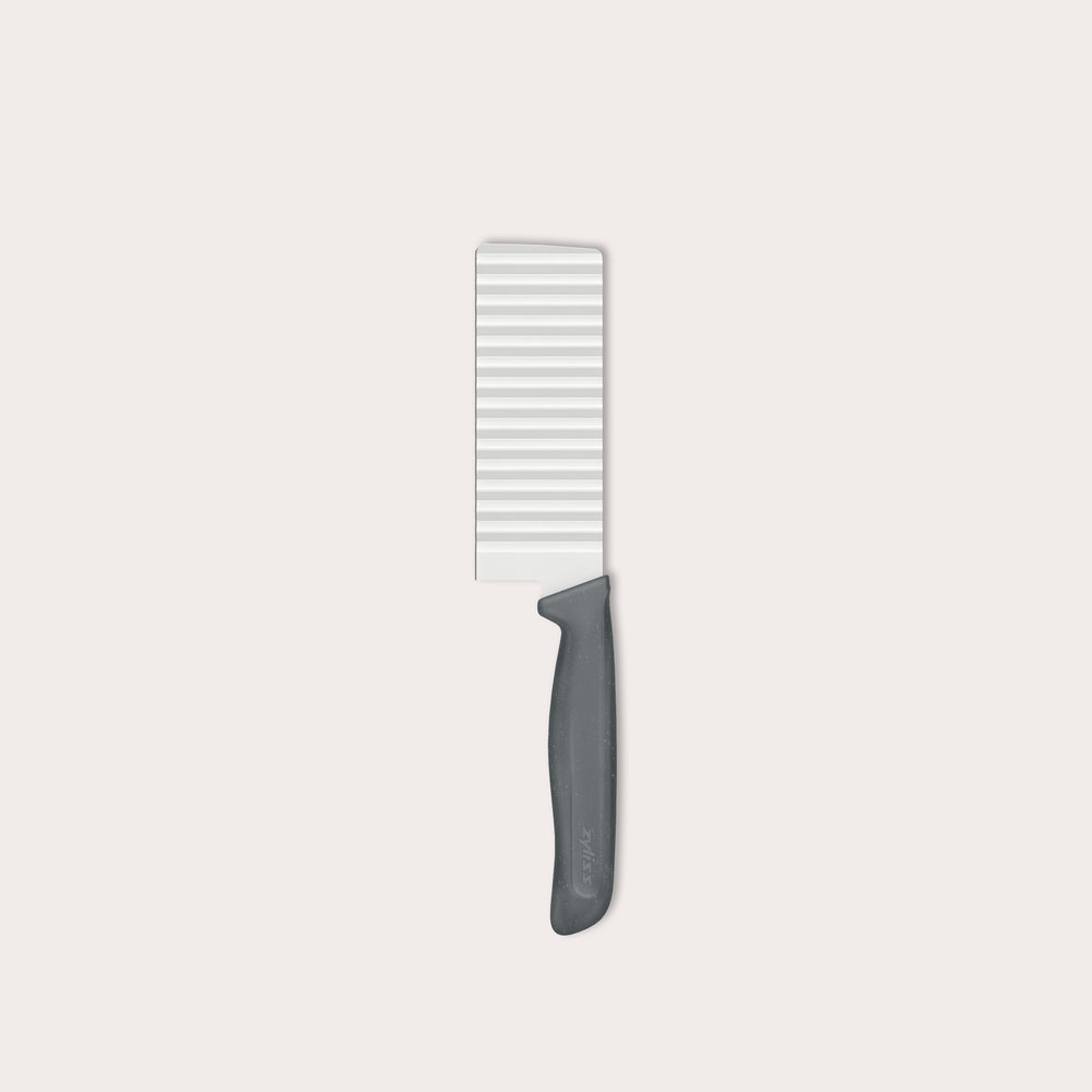 The Zyliss Crinkle Cut Knife 11.5cm/4" features a wavy stainless steel blade and ergonomic handle, shown on a light background.
