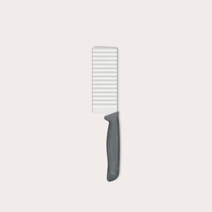 The Zyliss Crinkle Cut Knife 11.5cm/4" features a wavy stainless steel blade and ergonomic handle, shown on a light background.