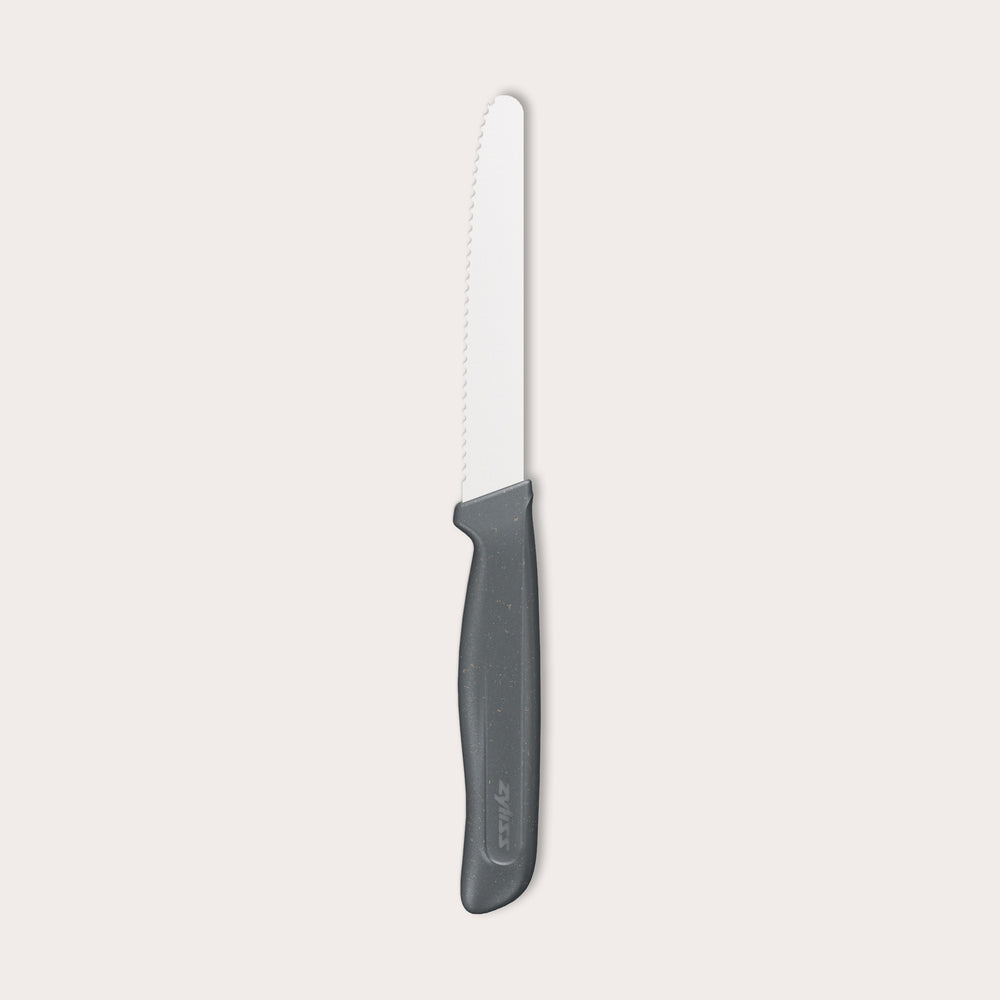The Zyliss Tomato Knife Serrated 11cm/4½" features a serrated white blade and a black eco-friendly plastic handle, shown against a plain light background—ideal for slicing tomatoes.