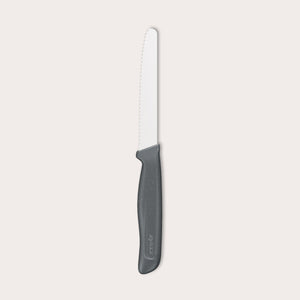 The Zyliss Tomato Knife Serrated 11cm/4½" features a serrated white blade and a black eco-friendly plastic handle, shown against a plain light background—ideal for slicing tomatoes.