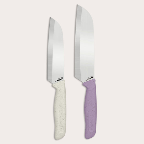 The Zyliss Classic 2 Piece Santoku Knife Set features two chef’s knives with stainless steel blades and ergonomic handles—one in speckled white and the other in speckled lavender—displayed side by side on a light background. Combining comfort with precision, this stylish duo is an excellent addition to any kitchen.
