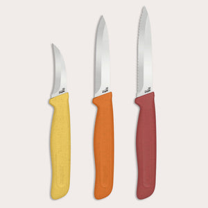 Three kitchen prep knives from the Zyliss Classic 3 Piece Peeling & Paring Knife Set are displayed upright against a light background. Each features a silver stainless steel blade and a colorful, speckled-texture handle in yellow, orange, or red. The rightmost knife includes a serrated blade—ideal for versatile peeling and paring tasks.