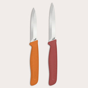 The Zyliss Classic 2-Piece Paring Knife Set features stainless steel blades: one with an orange handle and straight edge, the other with a red handle and serrated blade. Both have textured, ergonomic handles for comfort.