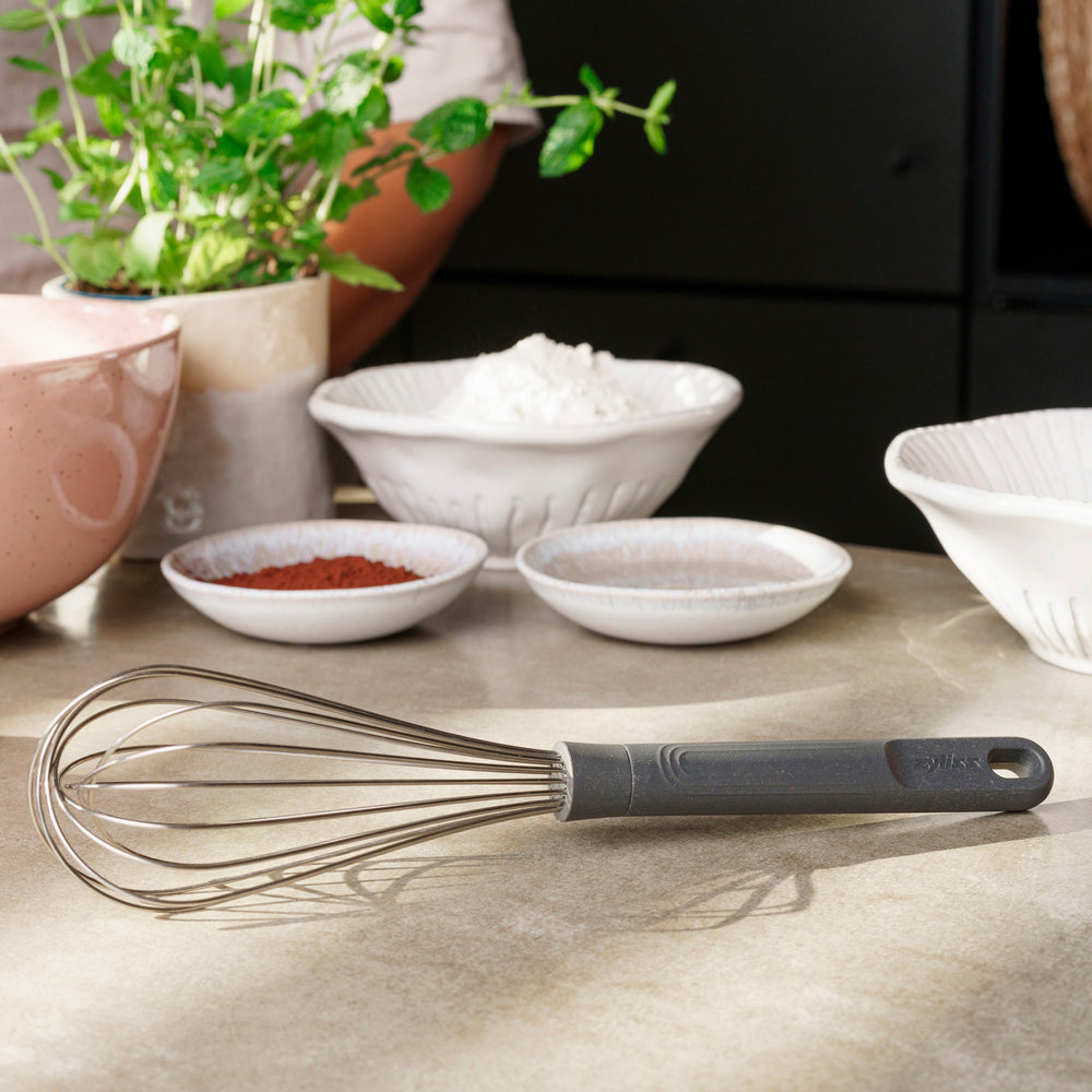 A Zyliss Balloon Whisk with a black handle is displayed on a white background. A circular label in the top left corner says 3 for 2 mix & match—ideal for non-stick cookware. #Large