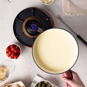 Zyliss Chalet Cast Iron Cheese Fondue Set, Red — in use