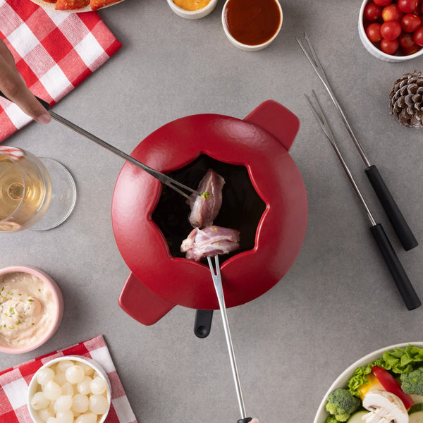 Zyliss Alpine Cast Iron Fondue Set, Red — in use