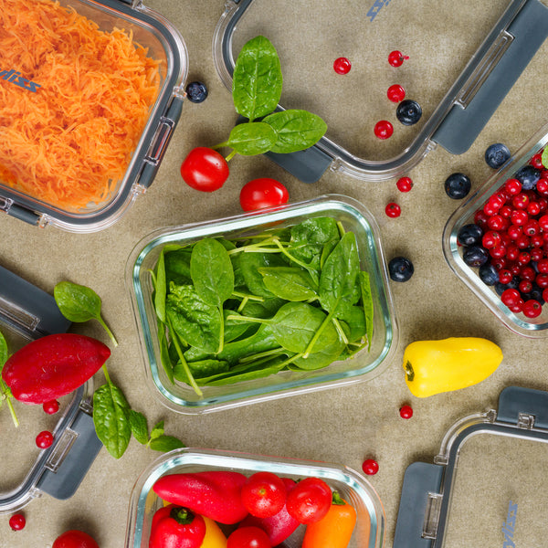 Zyliss Glass Containers filled with shredded carrots, fresh spinach, mixed berries, and mini peppers sit on the countertop—perfect for meal prep and keeping ingredients fresh thanks to their secure seal. #0.37L/0.39qt