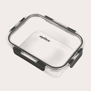 The Zyliss 3-Piece Set Glass Container Set features clear rectangular containers with black sealing rims and latches, a Zyliss logo on the lid, and a leak-proof design to keep your food fresh and secure.
