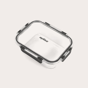 The Zyliss 3-Piece Set Glass Container Set features clear rectangular borosilicate glass containers with black locking clips and transparent, leak-proof lids. The Zyliss logo is displayed at the center of each lid.