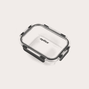 A clear rectangular Zyliss glass container from the 3-Piece Set features a black silicone-sealed, leak-proof lid with black locking clips. The brand name “Zyliss” appears on the lid, set against a light background.