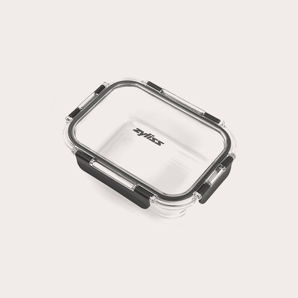 A clear rectangular Zyliss glass container from the 3-Piece Set features a black silicone-sealed, leak-proof lid with black locking clips. The brand name “Zyliss” appears on the lid, set against a light background.