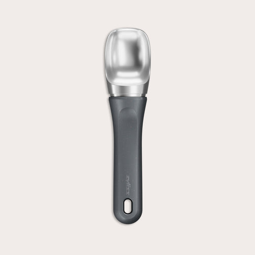 #belugagrey The Zyliss Ice Cream Scoop, featuring a wide deep bowl and eco-friendly handle, is displayed against a plain light background. 