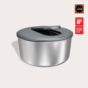 The Zyliss Swift Dry Salad Spinner Stainless Steel features a sleek silver bowl with a modern gray lid and handle. Shown are the Good Design and iF Design Award 2026 logos, highlighting its award-winning style and durability.