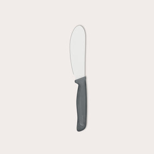 The Zyliss Spreading Knife 12cm/5" features a wide, rounded stainless steel blade and an ergonomic black handle, shown on a plain white background.