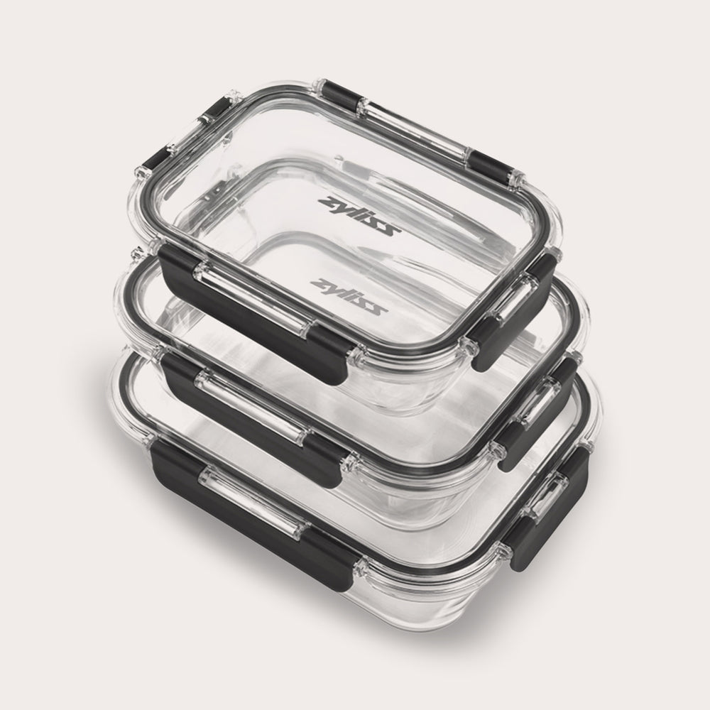 The Zyliss 3-Piece Set Glass Container Set includes clear rectangular borosilicate containers with black locking lids, shown stacked against a light background. They are leak-proof for safe, secure storage.