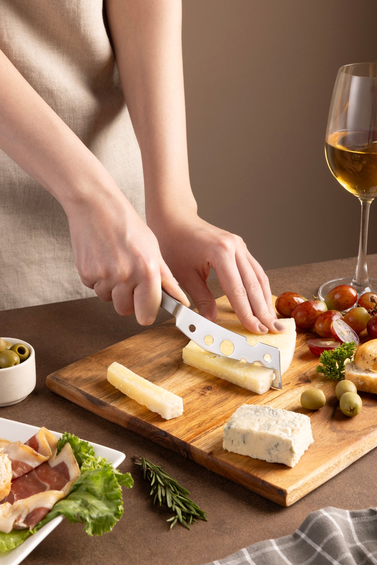 Zyliss Signature Semi-Soft Cheese Knife 116mm/4.6in — in use