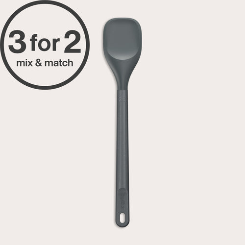 The Zyliss Spoontula, a grey heat-resistant silicone spoon with a long handle and durable head, rests on a light background. A circular label in the corner reads 3 for 2 mix & match.#Medium