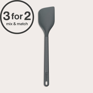 The Zyliss Spatula is a dark gray, heat-resistant silicone tool with a long handle and angled head. A circular 3 for 2, mix & match label appears in the corner. Safe for non-stick cookware and easy to clean, displayed on a plain white background.#Large