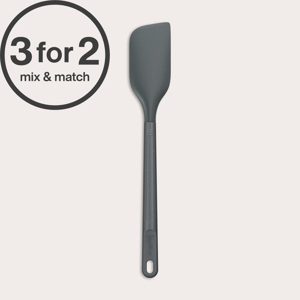 A dark grey Zyliss Spatula with a heat-resistant silicone head and handle hole is shown on a light background. A circular label in the top left corner reads 3 for 2 mix & match.#Medium