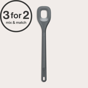 A long-handled, grey Zyliss Square Mixing Spoon made from heat-resistant silicone with a hole in the center is shown—an eco-friendly kitchen essential. A circular label at the top left displays 3 for 2 mix & match.