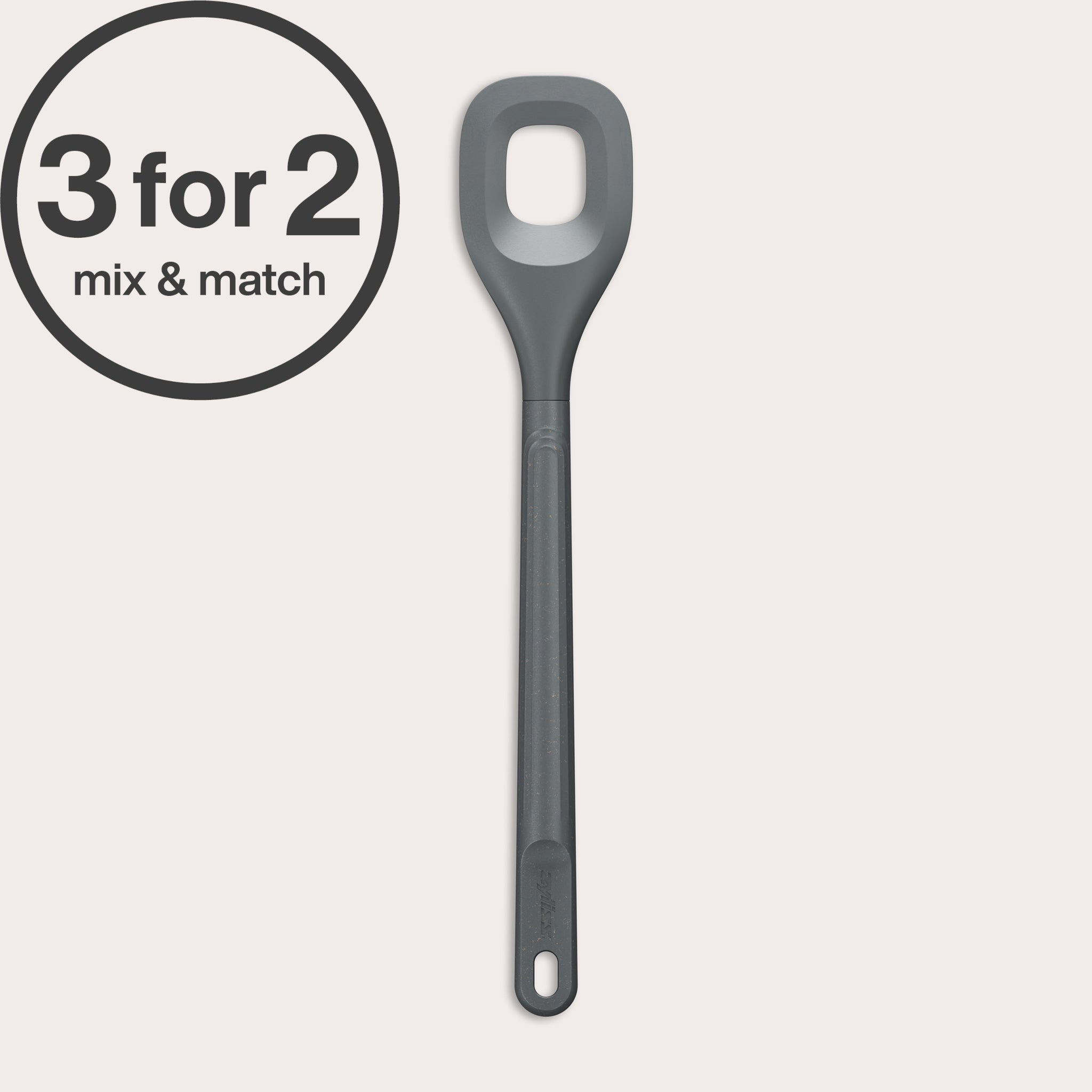 A long-handled, grey Zyliss Square Mixing Spoon made from heat-resistant silicone with a hole in the center is shown—an eco-friendly kitchen essential. A circular label at the top left displays 3 for 2 mix & match.