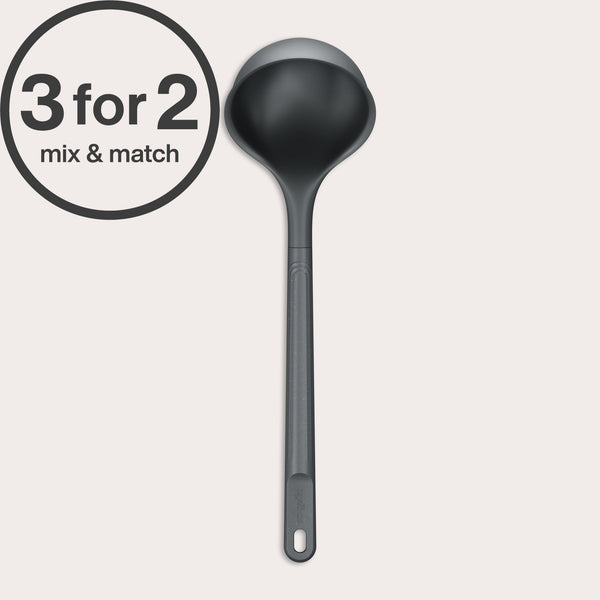 A black Zyliss Ladle with a long handle is centered on a light background. A circular label in the top left corner reads 3 for 2 mix & match—a heat-resistant kitchen essential from Zyliss. #Large