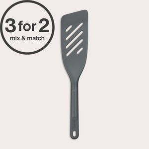 A dark gray Zyliss Fish Turner with a slotted, heat-resistant design and ergonomic handle is displayed on a white background. A circular 3 for 2 mix & match label appears in the top left corner.
