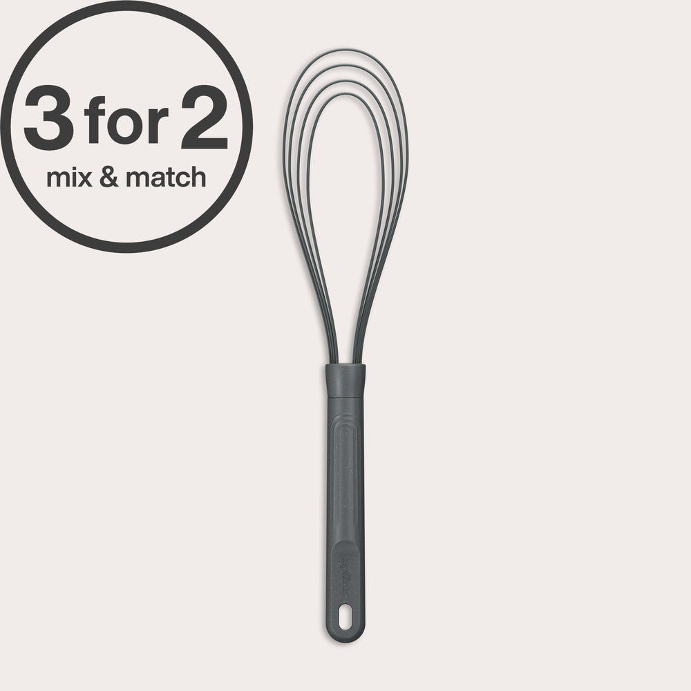 A black Flat Whisk Silicone by Zyliss with a heat-resistant design and plastic handle is shown on a white background. A 3 for 2 mix & match label appears in the top left. Ideal for use on non-stick surfaces.