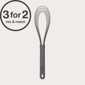 A black Flat Whisk Silicone by Zyliss with a heat-resistant design and plastic handle is shown on a white background. A 3 for 2 mix & match label appears in the top left. Ideal for use on non-stick surfaces.