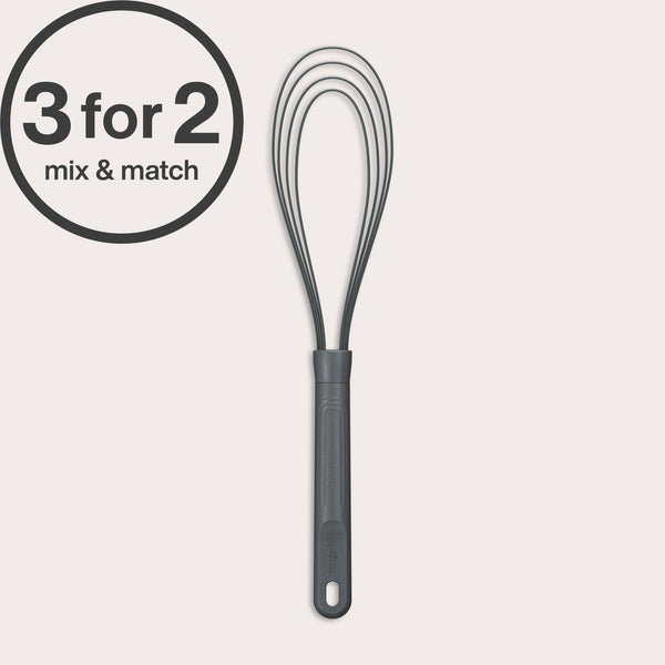A black Flat Whisk Silicone by Zyliss with a heat-resistant design and plastic handle is shown on a white background. A 3 for 2 mix & match label appears in the top left. Ideal for use on non-stick surfaces.