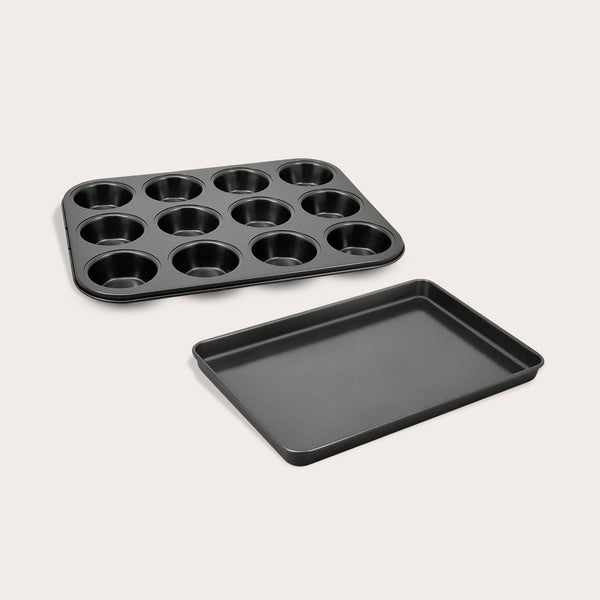 The Zyliss Muffin Pan & Baking Tray Bundle, including a black non-stick 12-cup muffin pan and a rectangular tray, is displayed side by side on a light background.