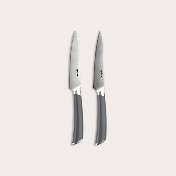 The Zyliss Comfort Pro Paring Knife Set features two stainless steel paring knives with gray handles, displayed side by side on a light background. The set includes one smooth-edged knife and one serrated paring knife, providing versatility for all your kitchen prep needs.